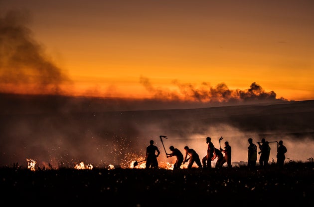 Firefighters tackle a wildfire on Winter Hill near Bolton this week.