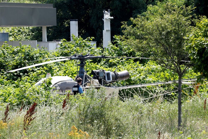 A French helicopter that was abandoned by French armed robber Redoine Faid is seen in Reau, southeast of Paris, on Sunday after his escape from prison.