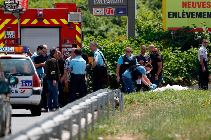 A forensic policeman is seen investigating the site where Faid's abandoned helicopter was found. The pilot may have been taken hostage, authorities said.