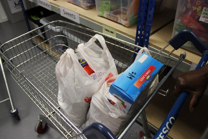 Items are placed into bags from the same supermarket to keep food donations discreet.