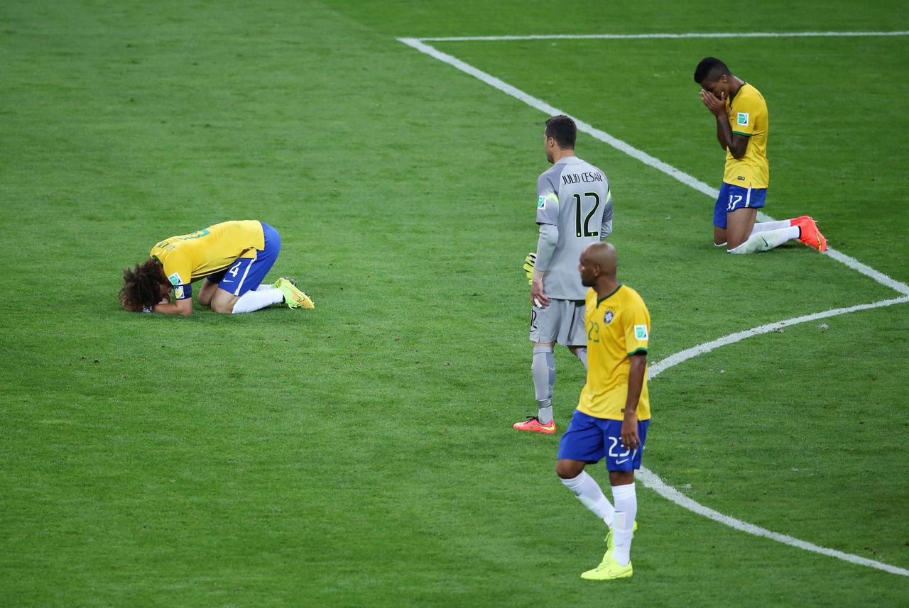 Brazilian players on the field in Belo Horizonte after the national team's devastating 7-1 loss to Germany in the 2014 World Cup semifinals.