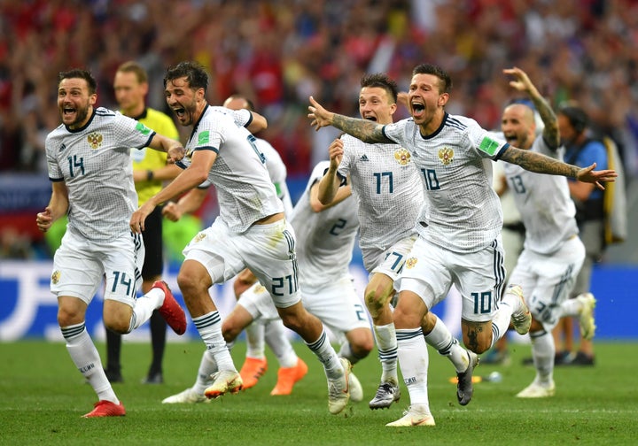 Russia players celebrate following their victory in a penalty shootout during the 2018 FIFA World Cup Russia Round of 16 matc