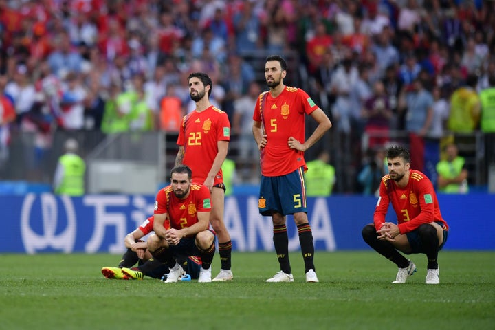 Spain players look dejected during a penalty shoot out against Russia on Sunday.