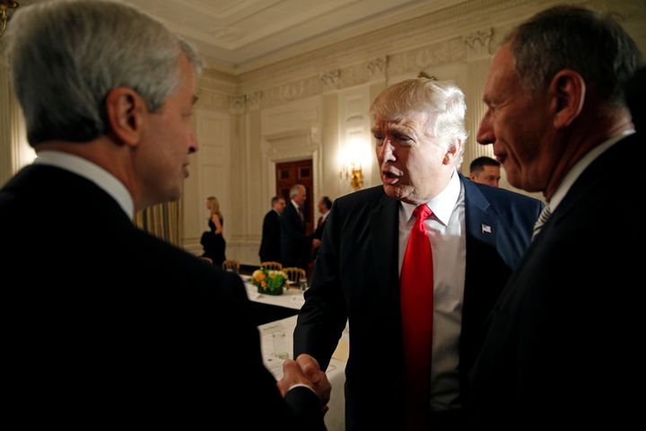 President Donald Trump shakes hands with JPMorgan Chase CEO Jamie Dimon at the White House in February 2017.