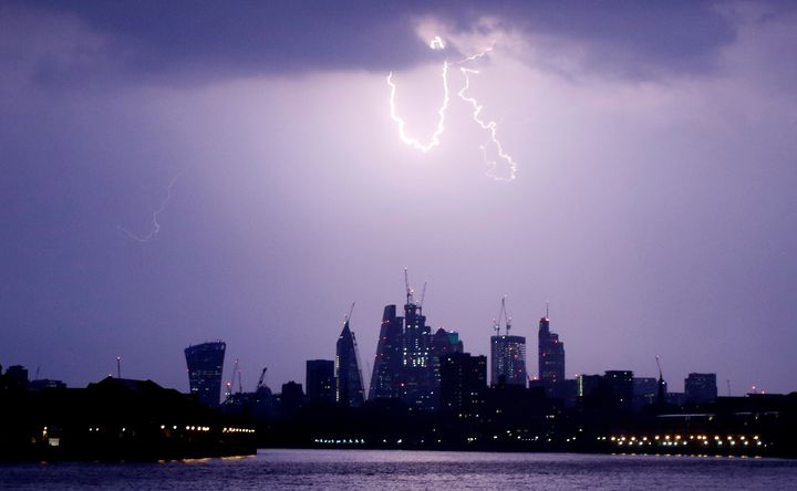 Parts of England could be hit by thunderstorms and heavy rain later today; a lightning strike over the capital is seen above in May 2018
