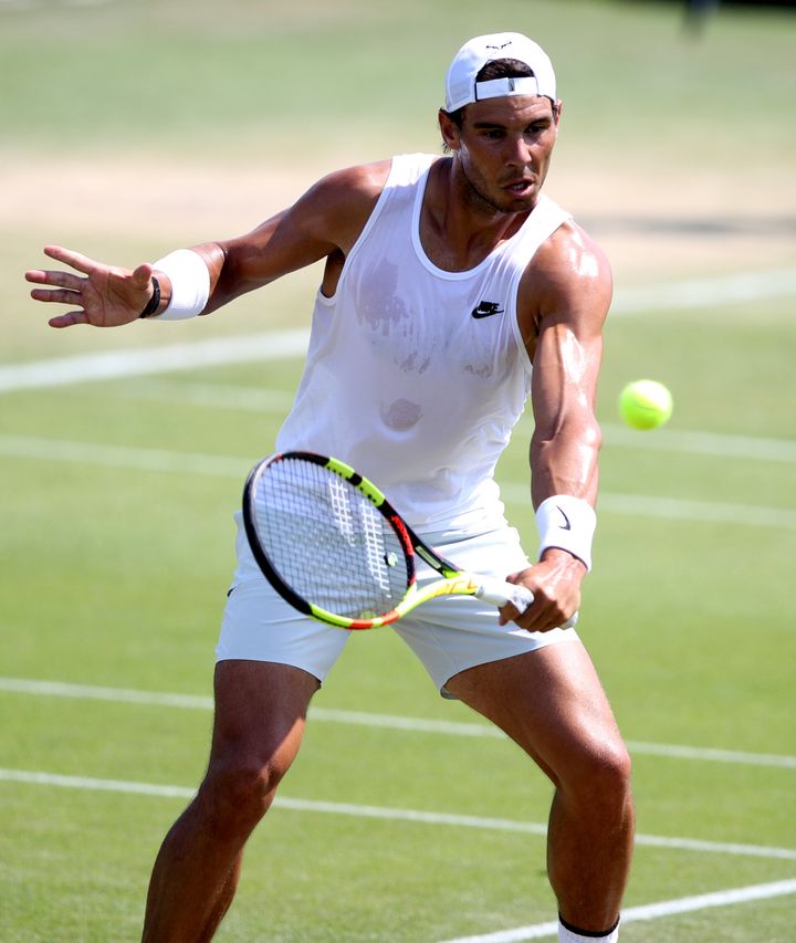 Rafael Nadal, seen above practising ahead of the 2018 Wimbledon Championships, has raised questions about the length of the grass on the courts