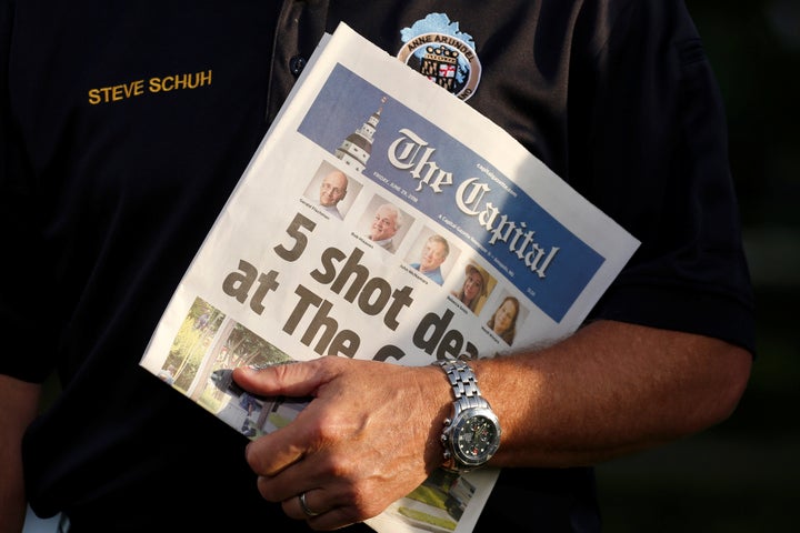 Steve Schuh, the county executive of Anne Arundel County, Maryland, holds a copy of The Capital as he is interviewed, June 29