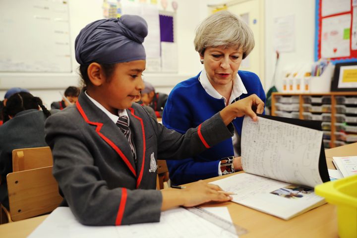 Theresa May meets pupils of Nishkam Primary School in Birmingham in 2017