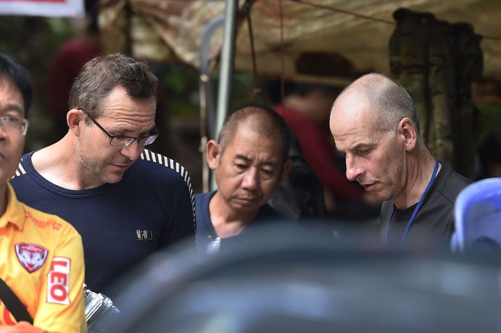 John Volanthen (L) and Richard William Stanton (R) are seen with Thai rescue personnel at the Tham Luang cave area.