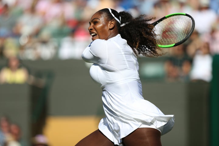 Serena Williams slugs a shot in her victory over Aranxta Rus on Monday at Wimbledon.