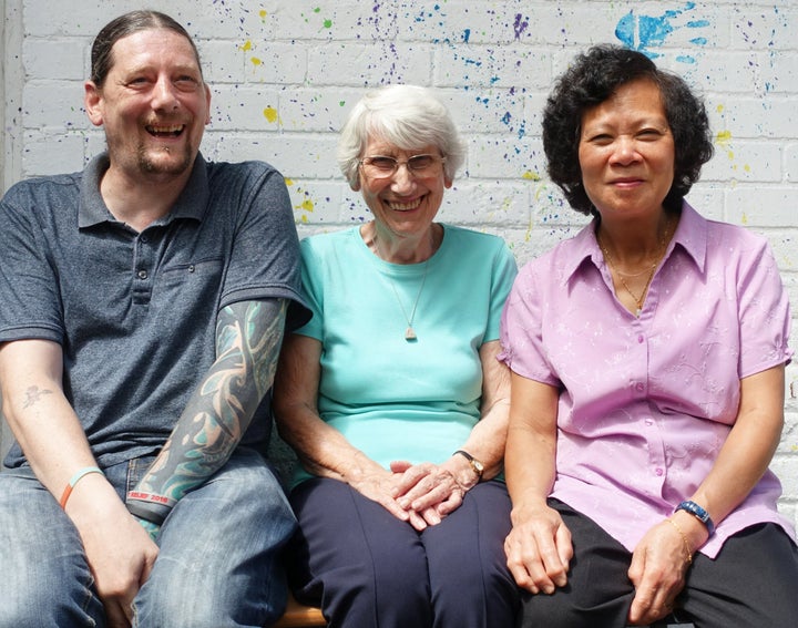 Enid Howles (centre) with two of the people she has supported: Ross Purchs (left) and Anh Quach (right).