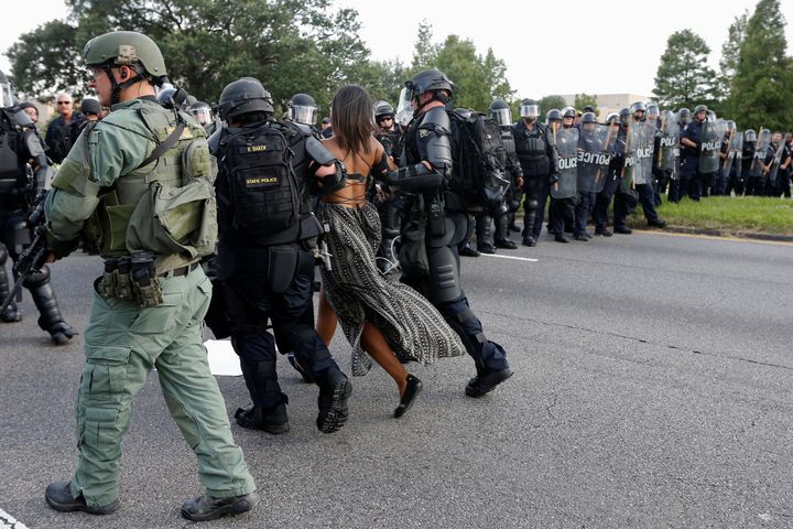 Protester Ieshia Evans is detained by law enforcement near the headquarters of the Baton Rouge Police Department in Baton Rouge, Louisiana, U.S. July 9, 2016.