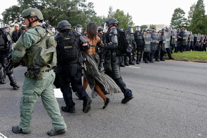 Protester Ieshia Evans is detained by law enforcement near the headquarters of the Baton Rouge Police Department in Baton Rouge, Louisiana, U.S. July 9, 2016.