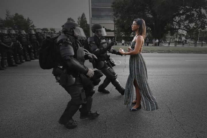 Ieshia Evans is detained by law enforcement as she protests the shooting death of Alton Sterling near the headquarters of the Baton Rouge Police Department in Louisiana, U.S. July 9, 2016.