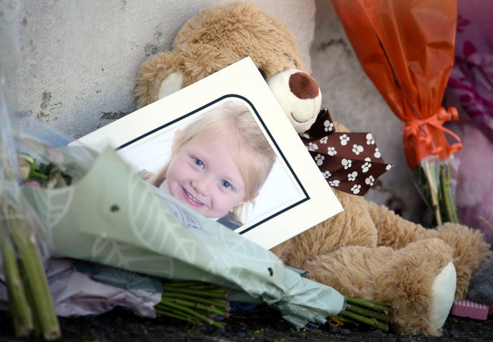 <strong>A picture among tributes near a house on Ardbeg Road on the Isle of Bute in Scotland, after the body of Alesha MacPhail was found in woodland on the site of a former hotel by a member of the public on Monday.</strong>