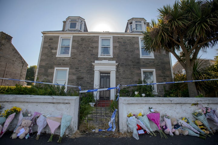 <strong>Police searching a house in Ardbeg Road on the Isle of Bute in Scotland.</strong>