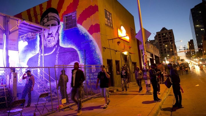 <p>Pedestrians walk past a Willie Nelson mural during the South by Southwest festival in Austin, Texas. The number of drunken pedestrians being killed in crashes has alarmed U.S. traffic safety experts. </p>