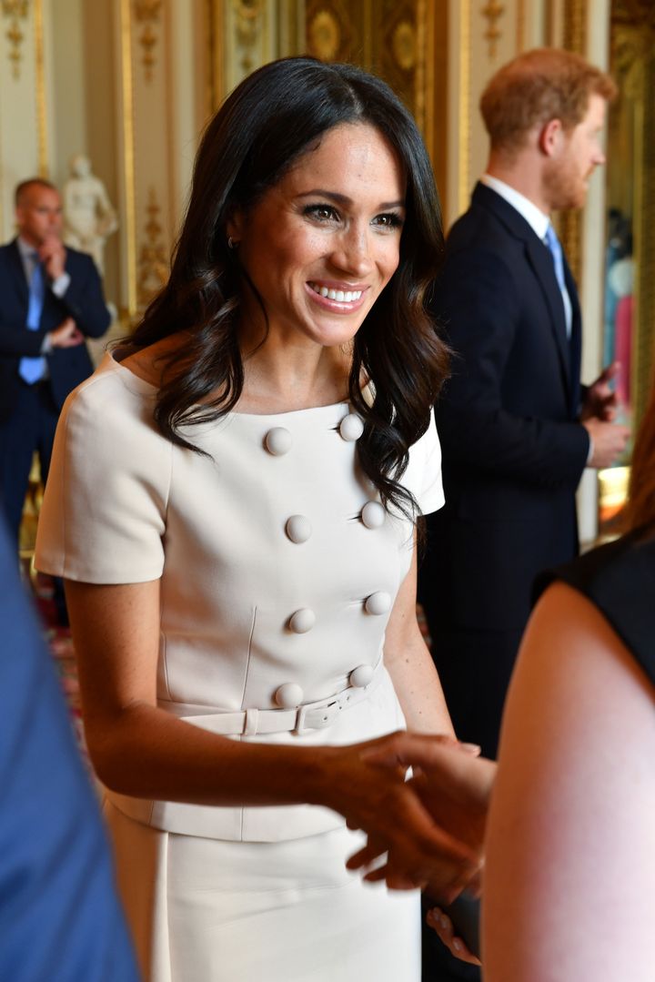 Markle meeting a group of the Queen's Young Leaders on June 26. 