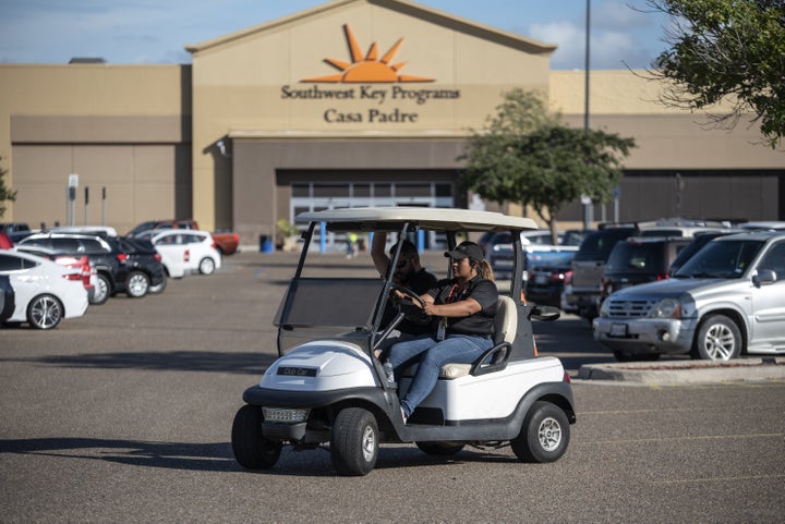 Security guards monitor the perimeter of the Southwest Key-Casa Padre Facility, formerly a Walmart store, in Brownsville, Texas, on June 17, 2018.