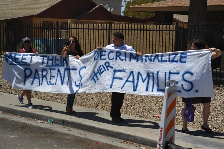 People protest as first lady Melania Trump visits Southwest Key's facility for children in Phoenix on June 28, 2018.