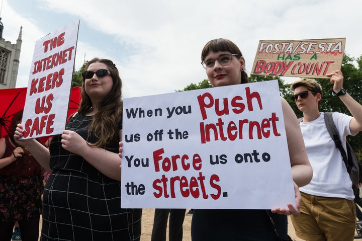 Sex workers, including trans comedian and artist Avery Edison, rallied in London on Wednesday. 