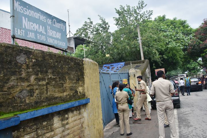 Indian police gathered outside Mother Teresa's Missionaries of Charity on Wednesday. A staff member and a nun were arrested on child trafficking charges.