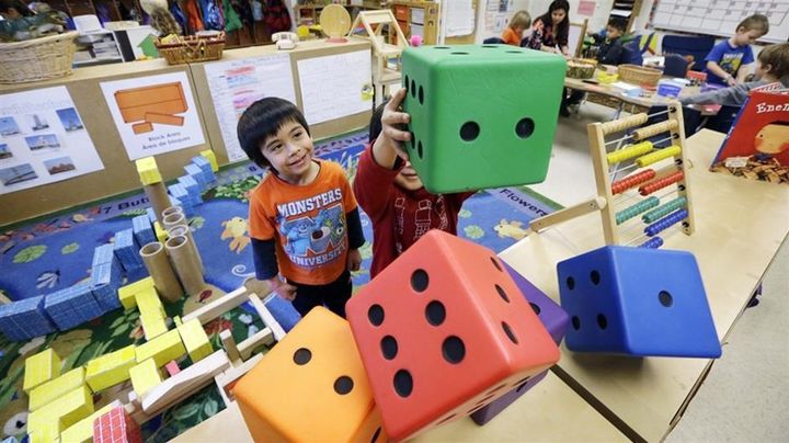 <p>Preschoolers at the Creative Kids Learning Center in Seattle. A growing number of cities and states are imposing academic standards and other rules on child care providers and using public money to expand access to them. </p>