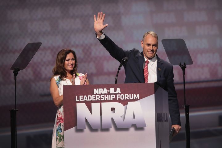 Secretary of the Interior Ryan Zinke, with his wife, Lolita Zinke, addresses an NRA forum in Atlanta, April 28, 2017. Ethics officials say Benjamin Cassidy, a former NRA lobbyist appointed to the Interior Department last year, likely violated ethics rules.
