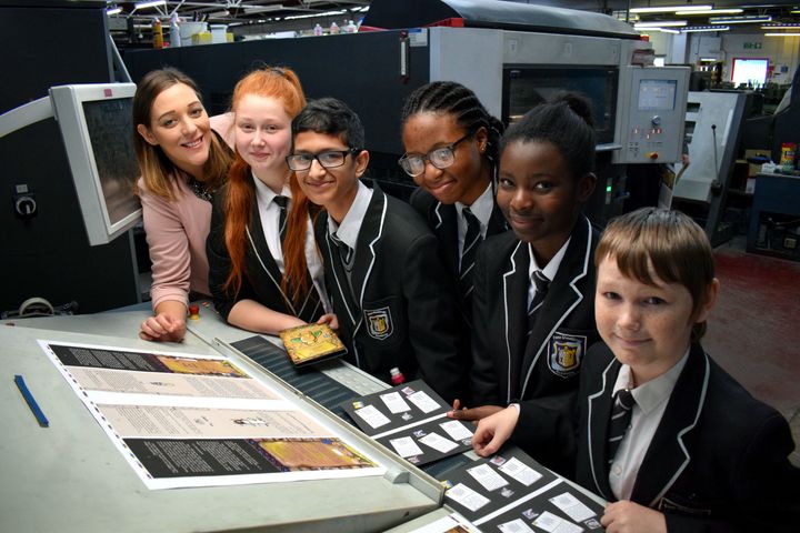 The five Year 8 pupils involved in creating the book seeing it getting printed.