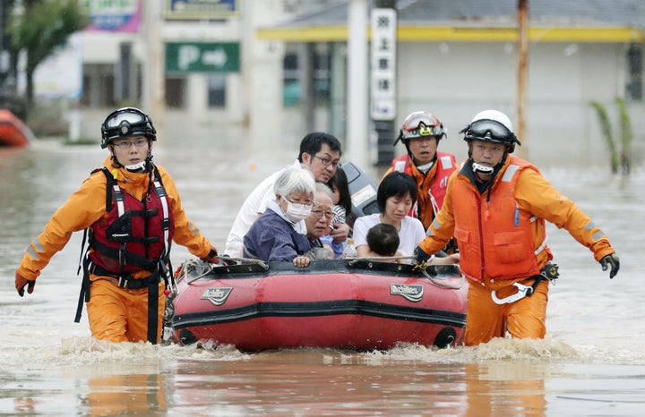  Local residents rescued from a flooded area in Kurashiki on July 8, 2018. 