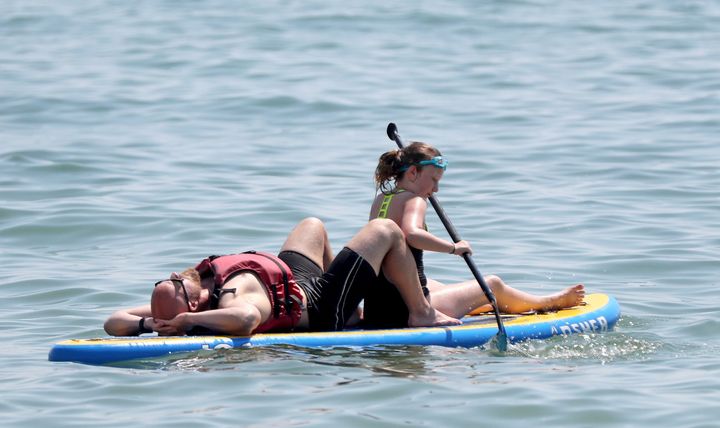 People enjoy the sunshine on Brighton beach as the warm weather continues across the country.