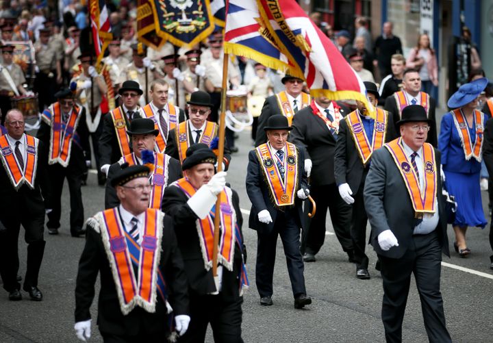 Participants taking part in Orange Walks across the city of Glasgow on Saturday
