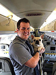 JetBlue flight attendant Renaud Spencer with Darcy the French bulldog.