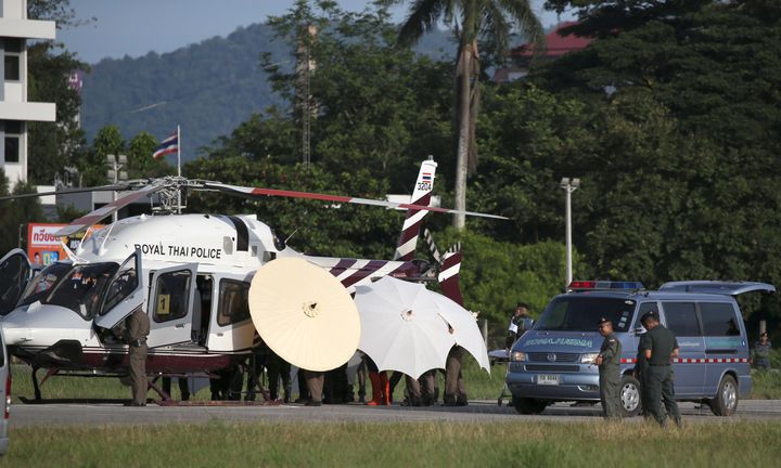 Rescued schoolboys are moved from a helicopter to an ambulance at a military airport in Chiang Rai