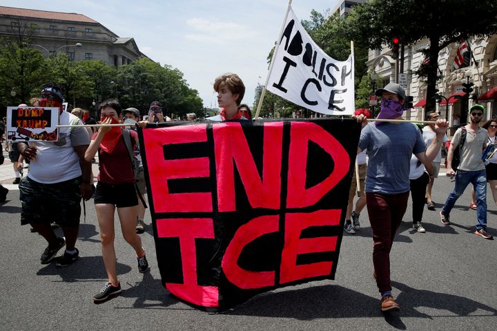 Activists protest the Trump administration&rsquo;s immigration policies outside the Department of Justice in Washington, June