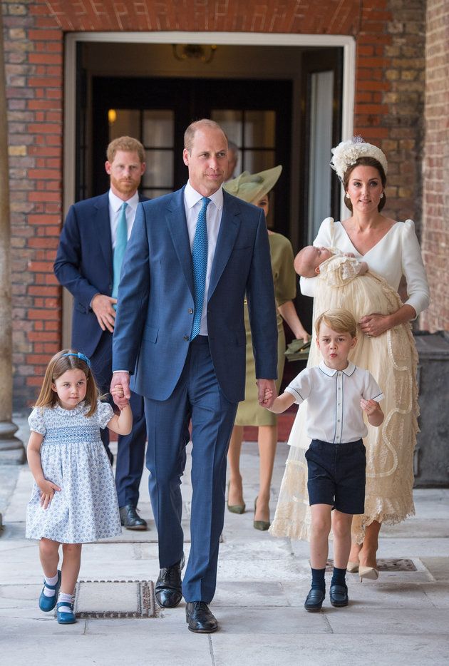 Princess Charlotte and Prince George hold the hands of their father, the Duke of Cambridge, as they arrive at the Chapel Royal, St James's Palace, London for the christening of their brother, Prince Louis, who is being carried by their mother, the Duchess of Cambridge. 