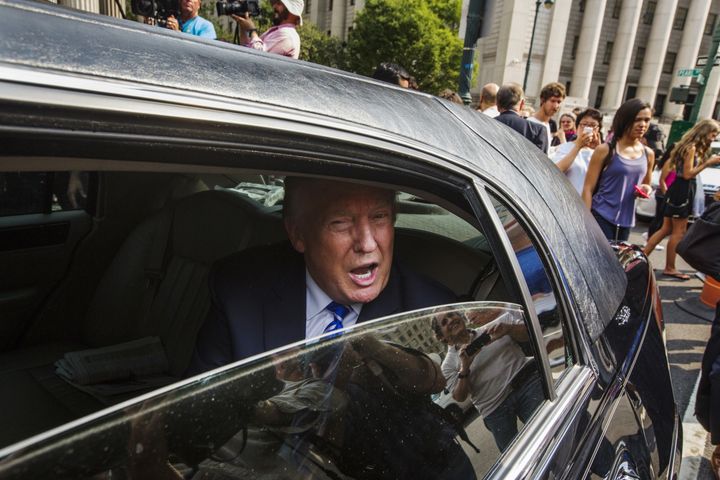 Donald Trump sits in a limousine as he leaves Manhattan Supreme Court after jury duty on Aug. 17, 2015.