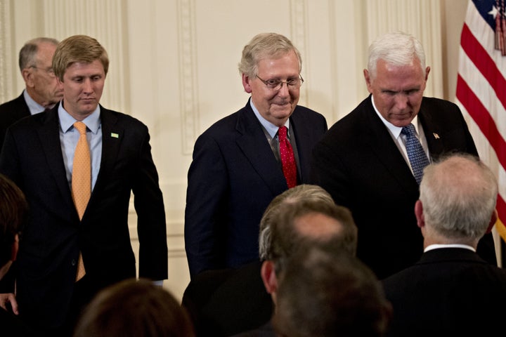 Senate Majority Leader Mitch McConnell and Vice President Mike Pence attend the U.S. Supreme Court nomination announcement ceremony in the East Room of the White House.