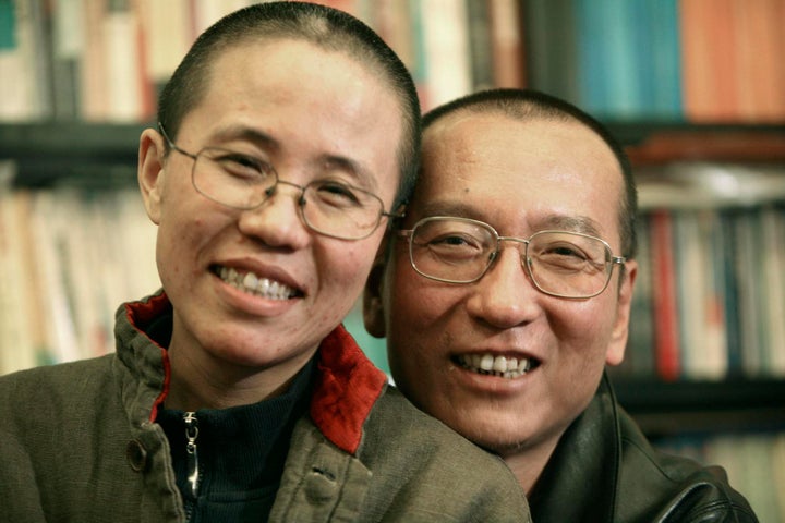 Chinese dissident Liu Xiaobo, right, and his wife Liu Xia pose in this undated photo released by his family in 2010.