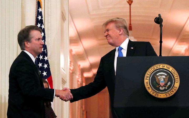US President Donald Trump shakes the hand of his Supreme Court nominee Judge Brett Kavanaugh