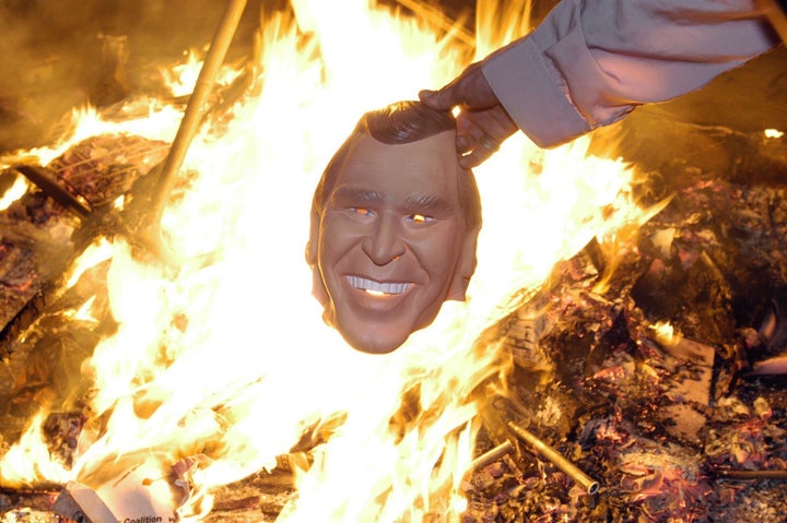 Anti-Bush protesters gather around a bonfire in London's Trafalgar Square, with thousands of protesters taking part in an anti-war demonstration on the second day of President George W. Bush's 2003 state visit.