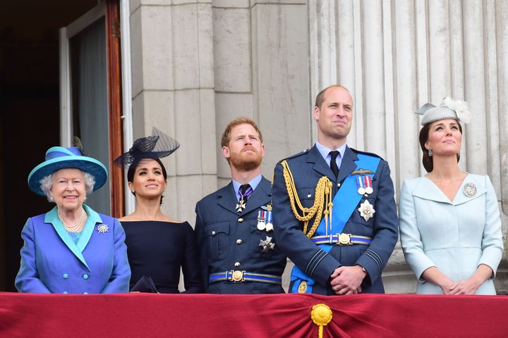 The royals observe the RAF 100th anniversary flypast from the balcony of Buckingham Palace on July 10 in London. 