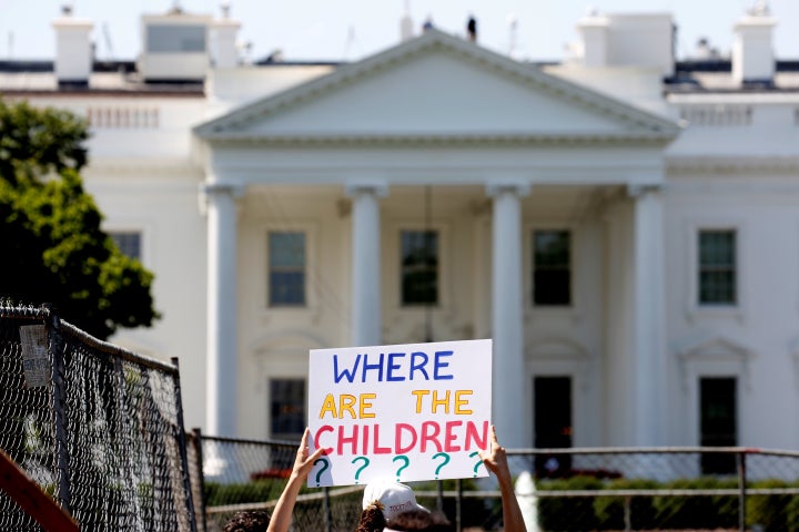 An immigration activist holds a sign against family separation during a rally in June to protest the Trump administration's immigration policy outside the White House.