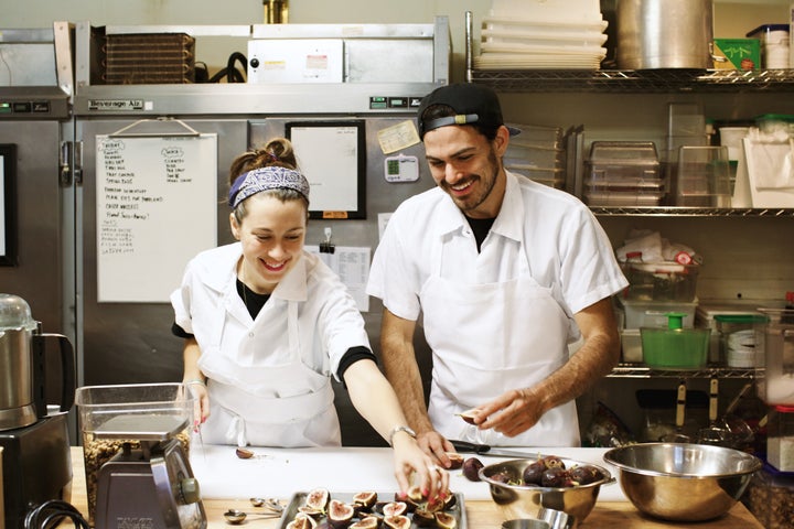 Van Leeuwen founders Laura O'Neill and Ben Van Leeuwen work with fresh figs in the kitchen of their production facility in Brooklyn, which supplies ice cream for all of the brand's New York City shops.