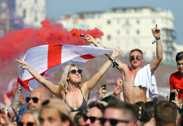 Fans react whilst watching the FIFA World Cup 2018 quarter-final match between Sweden and England at Luna Beach Cinema, Brighton.