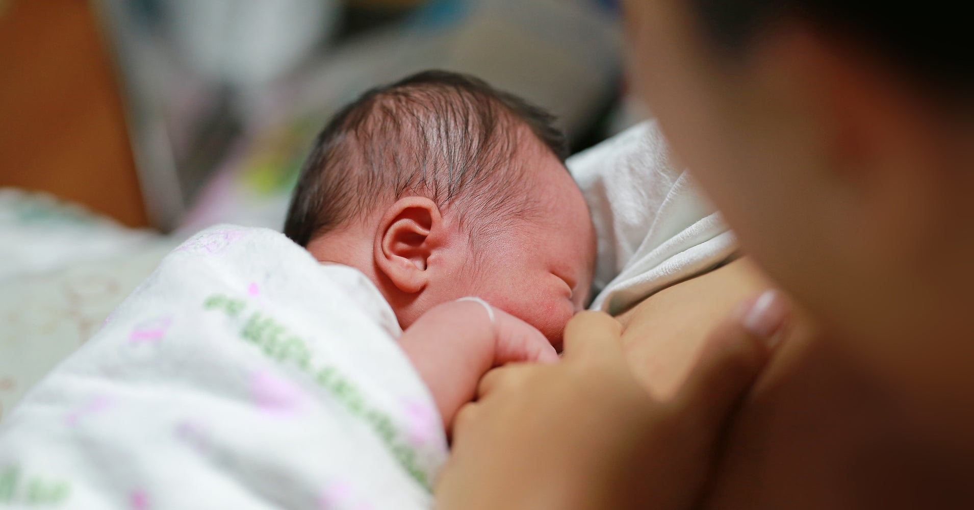 smiling-mother-holding-and-breastfeeding-her-baby-stock-video-footage