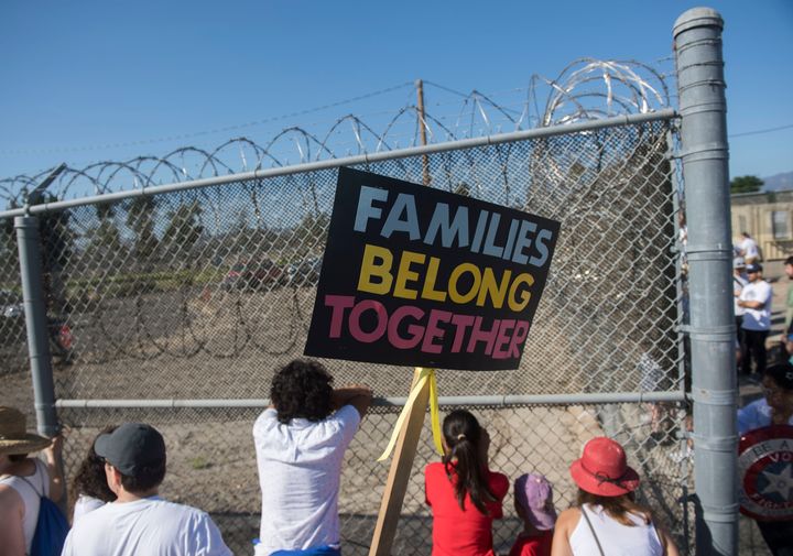 Protesters stand outside the James A. Musick Facility, a detention center that houses unauthorized immigrants, to protest President Trump's immigration policies.
