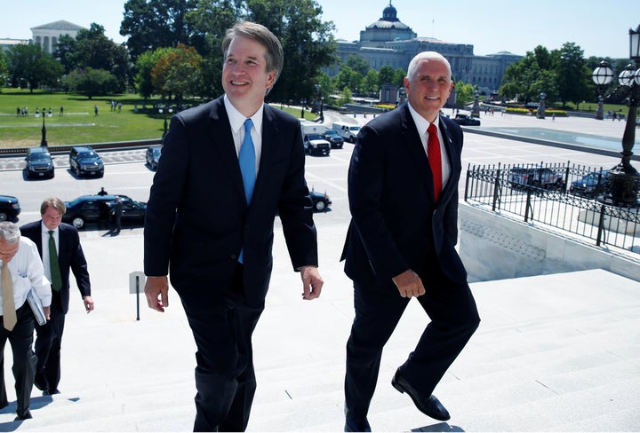 Supreme Court nominee Brett Kavanaugh on Tuesday arrives with U.S. Vice President Mike Pence prior to meeting with Senate Majority Leader Mitch McConnell on Capitol Hill.