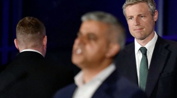 Britain First leader Paul Golding turns his back on Sadiq Khan during the mayor's victory speech while defeated Conservative candidate Zac Goldsmith watches on. 