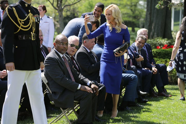 White takes photos during a National Day of Prayer event in the Rose Garden on May 3, 2018.